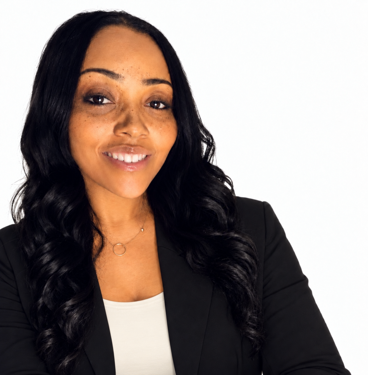 Carla M., SELF-MADE founder and strategist, wearing a black blazer and cream shirt